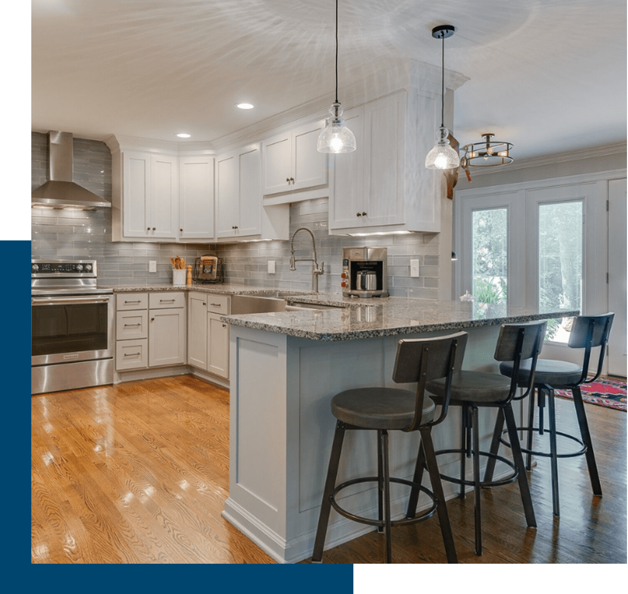 Modern kitchen with island and bar stools.