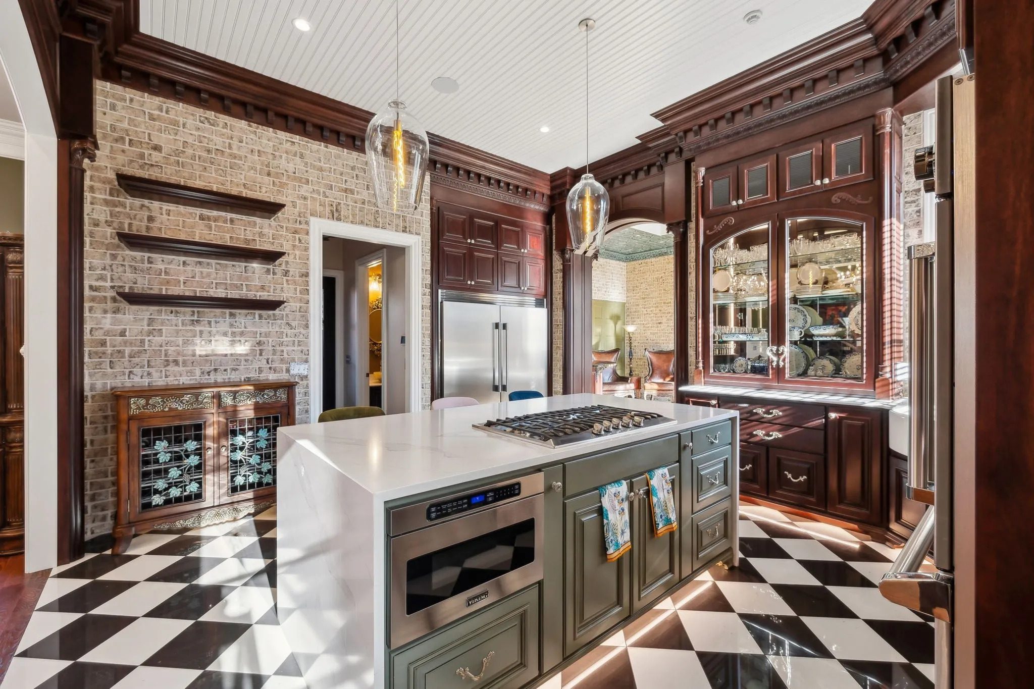 Elegant kitchen with checkered floor and wooden cabinetry.