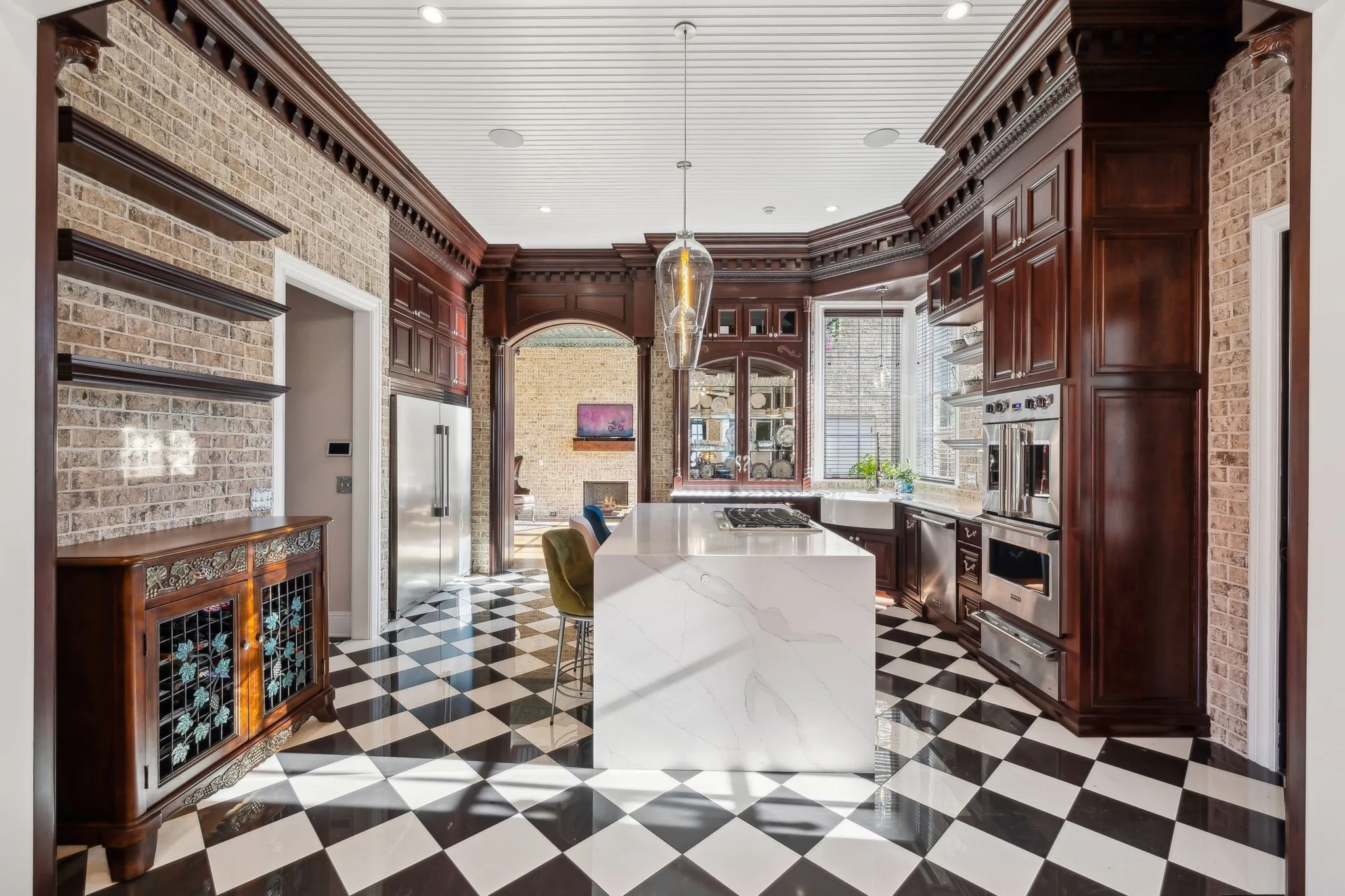 Elegant kitchen with dark wood cabinetry and checkered floor.